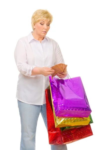 Mulher sênior com carteira e sacos — Fotografia de Stock