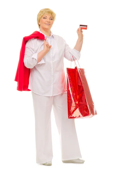 Mujer mayor con bolsa y tarjeta de crédito —  Fotos de Stock
