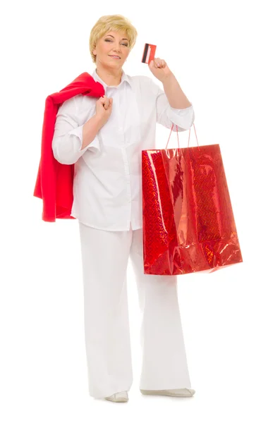 Mulher sênior com saco e cartão de crédito — Fotografia de Stock