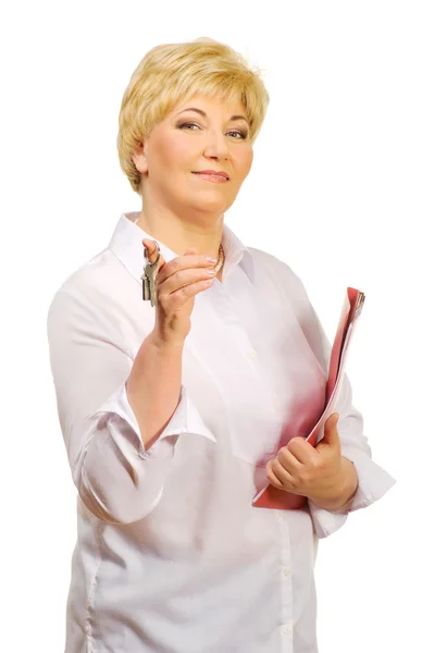 Senior woman with keys and folder — Stock Photo, Image