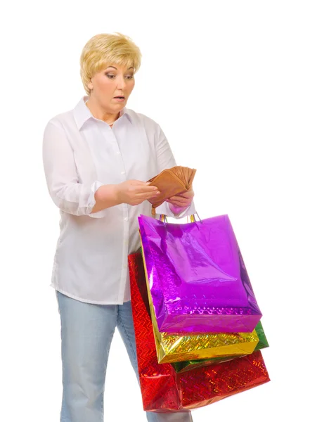Senior woman with wallet and bags — Stock Photo, Image