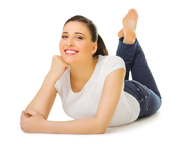 Young smiling girl laying on the floor — Stock Photo, Image