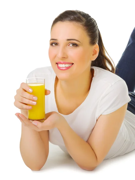 Smiling young girl with orange juice — Stock Photo, Image