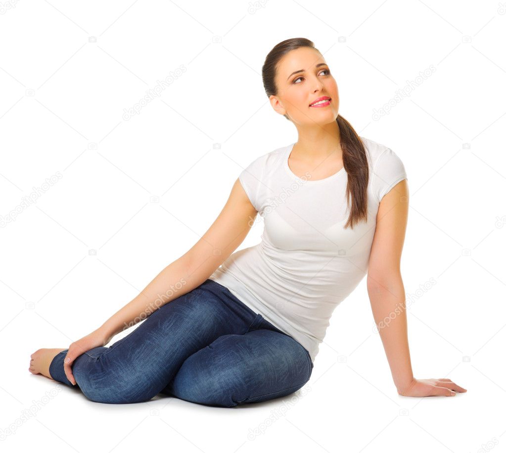 Smiling young girl sit on the floor — Stock Photo © rbvrbv #11646483