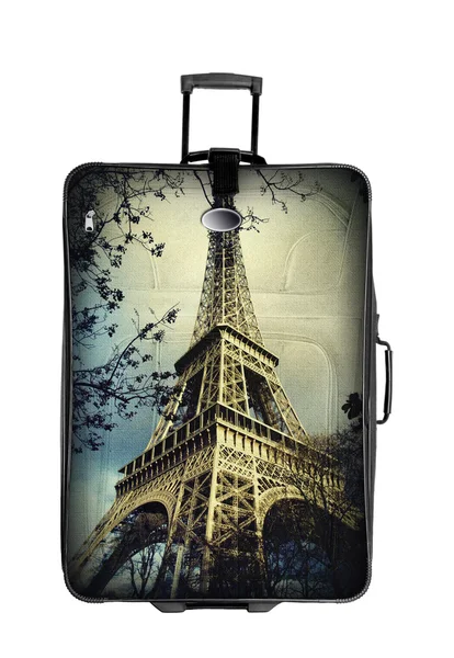 Темный чемодан с Эйфелевой башней фото изолированы над белым — стоковое фото
