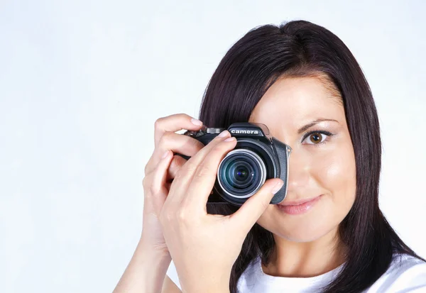 Young woman holding digital camera — Stock Photo, Image