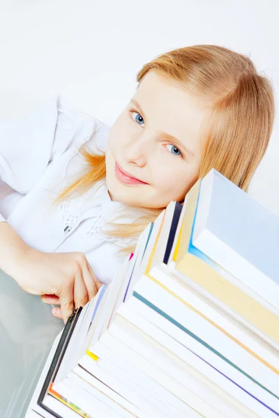 Small smiling girl with books — Stock Photo, Image