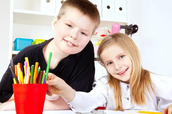 Two small children in school — Stock Photo, Image