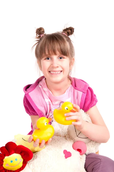 Девочка и игрушки — стоковое фото