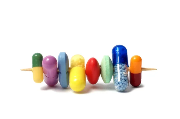 Tabletták egy fogpiszkáló — Stock Fotó