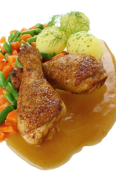 Chicken leg with vegetables and sauce — Stock Photo, Image
