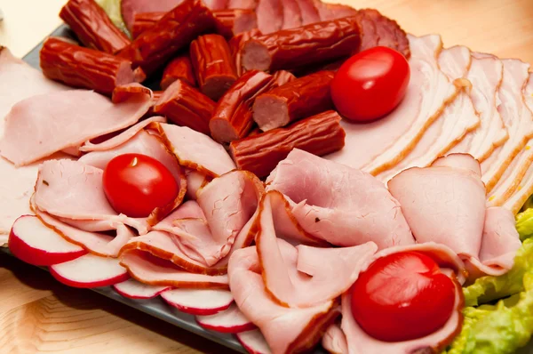 stock image Platter of cold cuts and sausages with ham