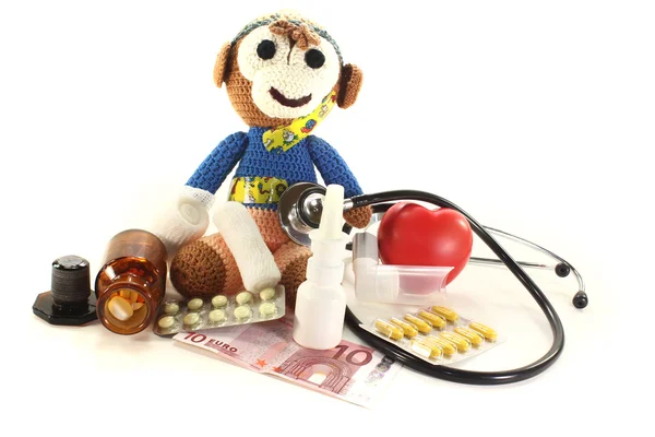 Pediatra com macaco e dinheiro — Fotografia de Stock