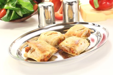 Puff pastry filled with cheese and bell peppers clipart