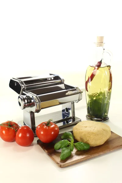 stock image Noodle dough with a pasta machine and oil