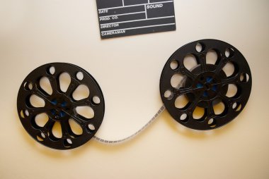 Two retro motion picture film reels clipart