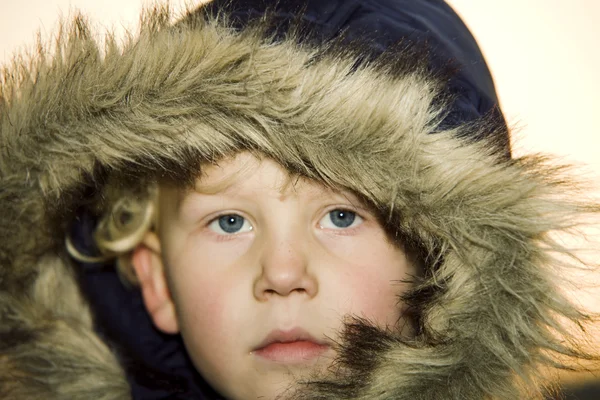 stock image Little boy wearing a fur lined hood