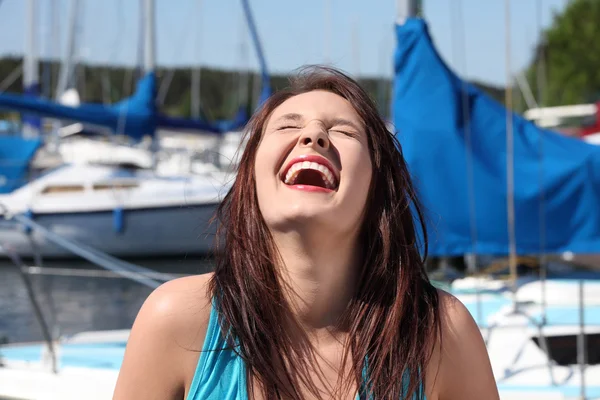 Woman in front of yacht boat is laughing. — Stock Photo, Image