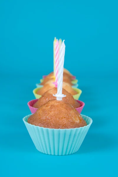 Festive cupcakes with candles — Stock Photo, Image