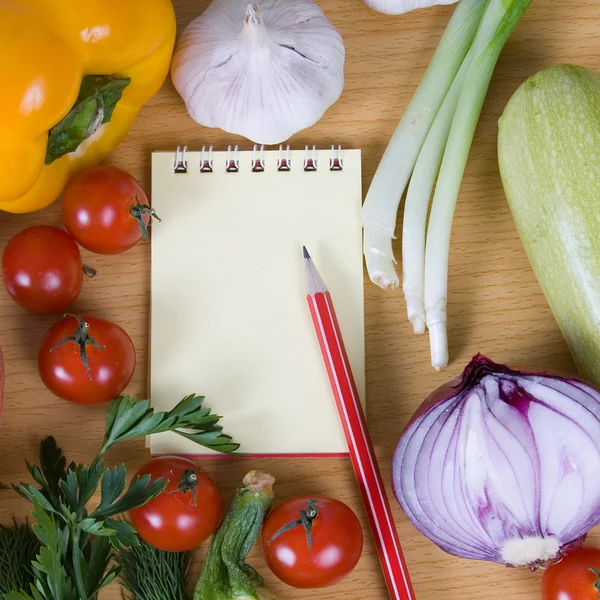 stock image Fresh vegetables and a notebook