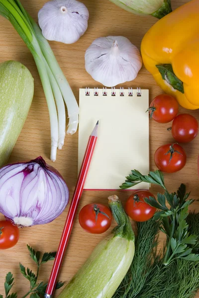 stock image Fresh vegetables and a notebook