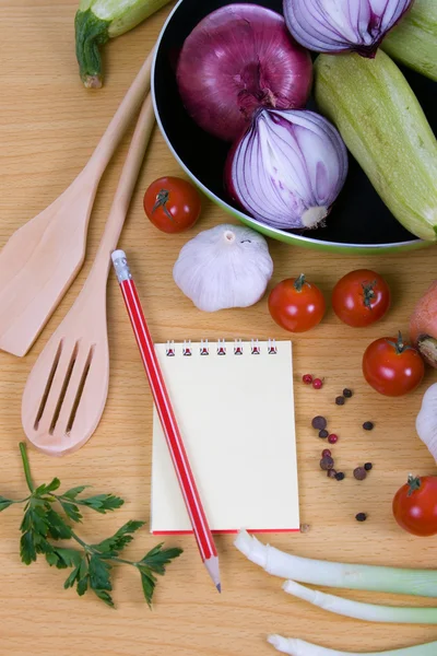 stock image Fresh vegetables and a notebook