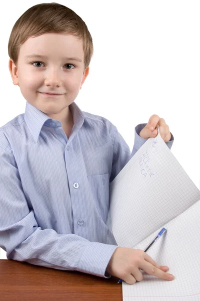 Boy shows a writing-book Stock Photo
