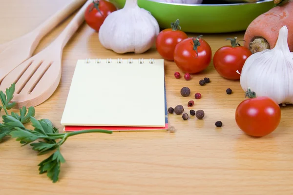 stock image Fresh vegetables and a notebook