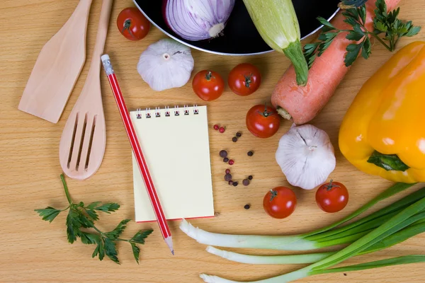 stock image Fresh vegetables and a notebook