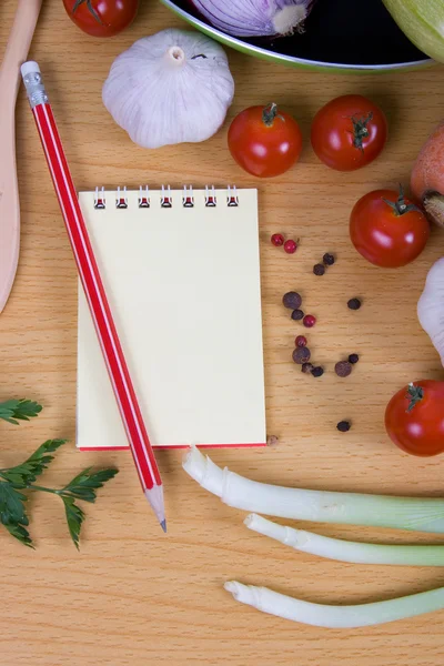 stock image Fresh vegetables and a notebook