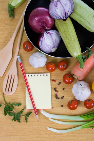 stock image Fresh vegetables and a notebook