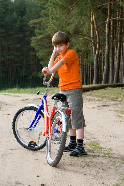 Boy with a bicycle — Stock Photo, Image