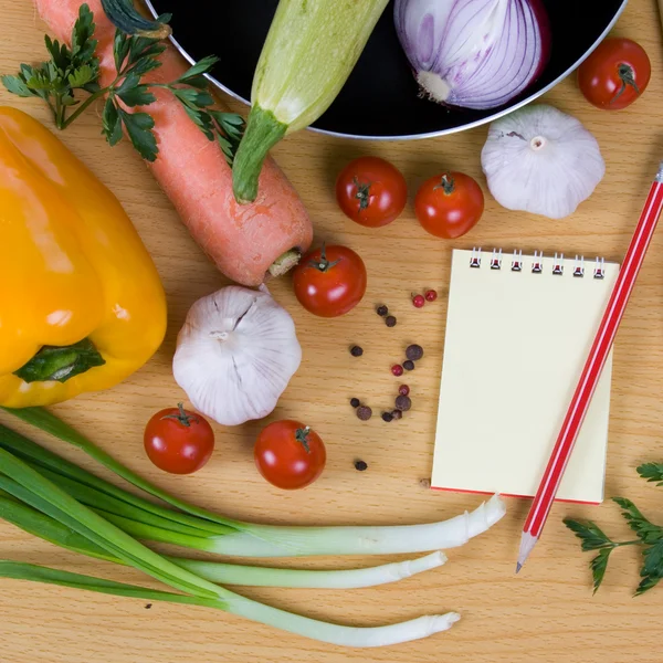 stock image Fresh vegetables and a notebook