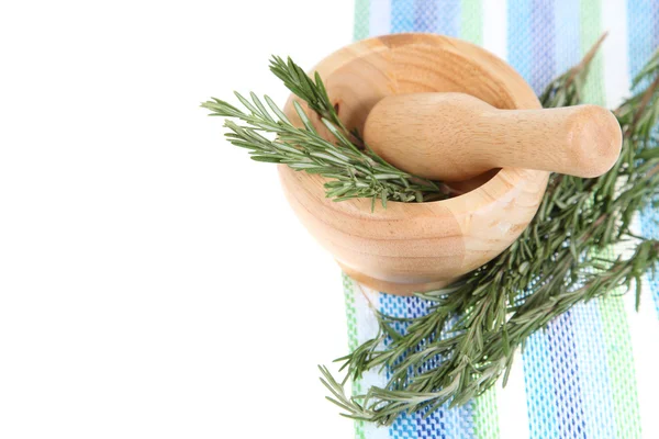 Rosemary in a wooden pounder — Stock Photo, Image