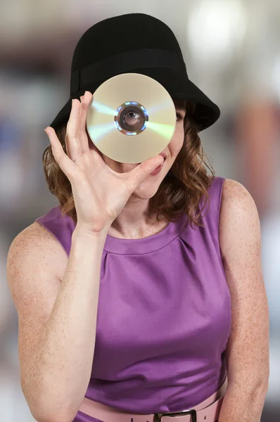 stock image Woman holding CD or DVD