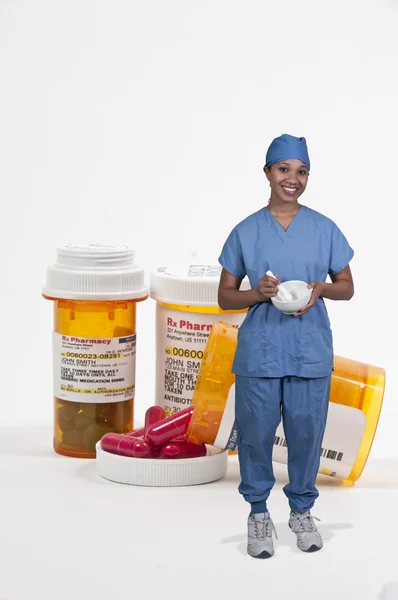 Orvos és egy üveg kapható tabletták — Stock Fotó