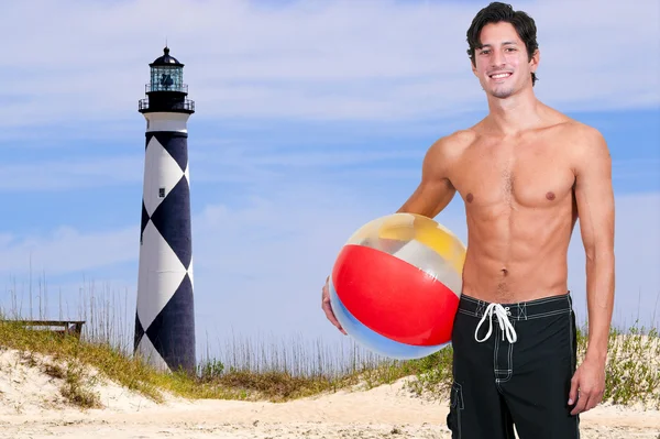 Adam holding beachball — Stok fotoğraf