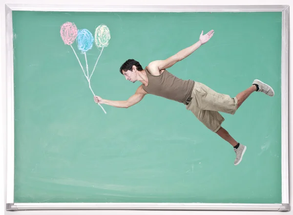 Man Floating with Chalk Balloons — Stock Photo, Image