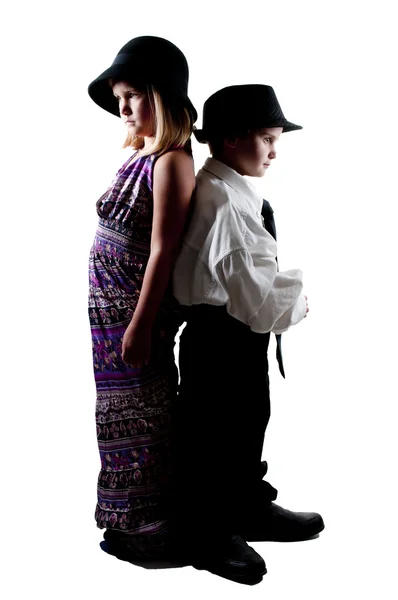 Menino e menina em roupas grandes — Fotografia de Stock