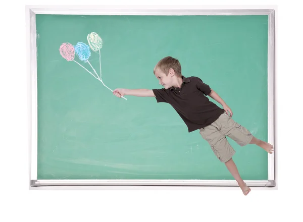 Niño flotando con globos de tiza — Foto de Stock