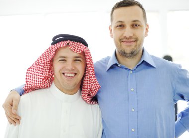 Arabic and caucasian european men together clipart