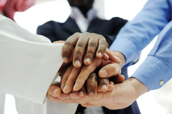 Business team överlappande händer — Stockfoto