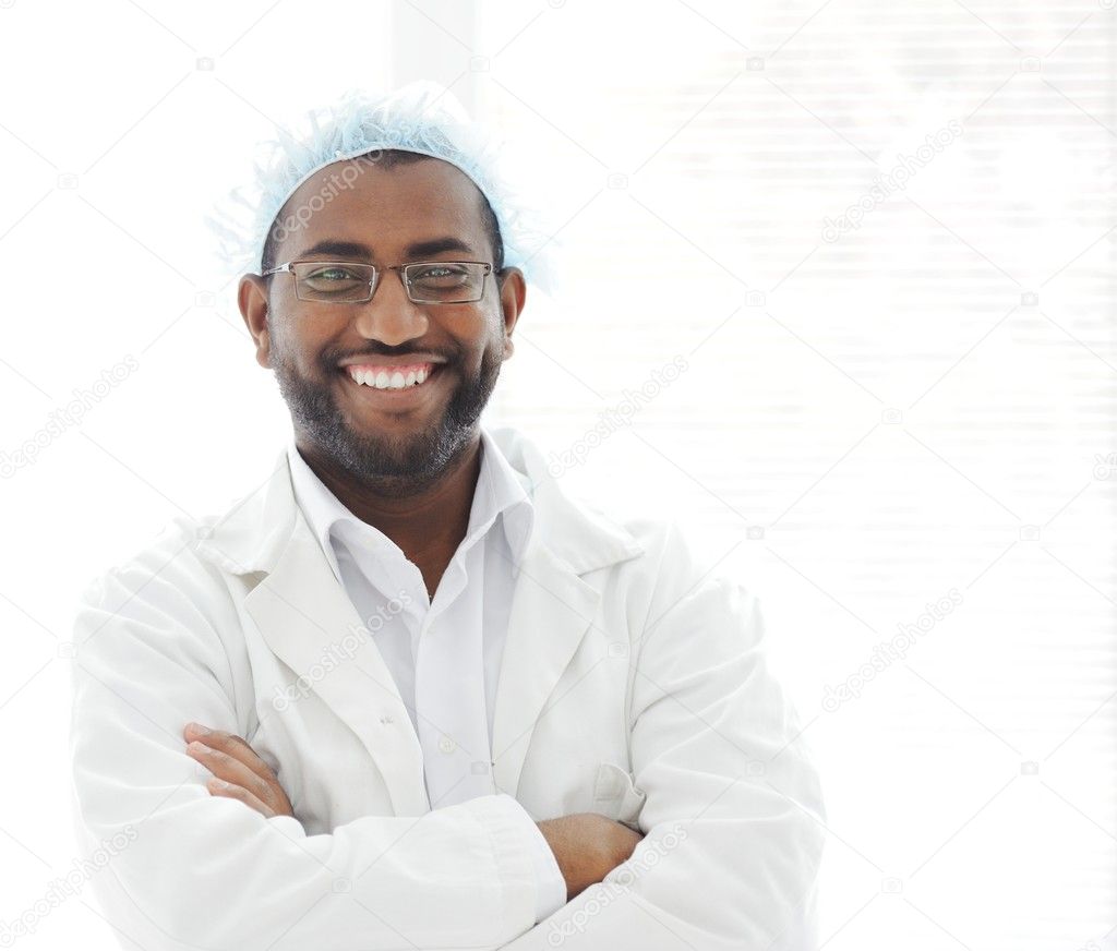 Confident African American male surgeon smiling