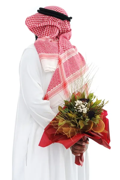 Bliskiego Wschodu człowiek chowa się za róże dla żony — Zdjęcie stockowe
