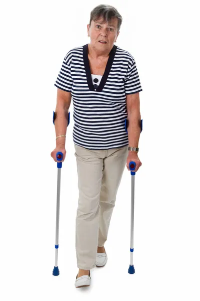 Senior woman on crutches — Stock Photo, Image
