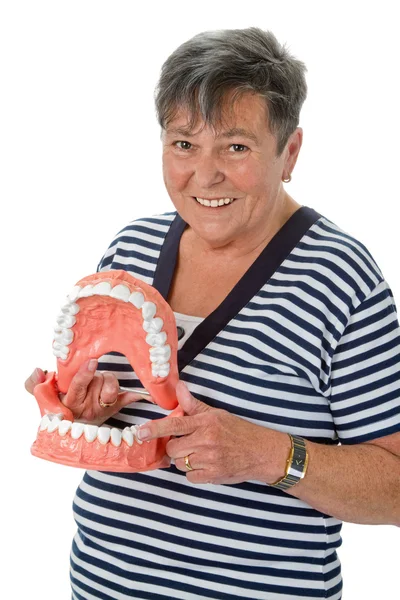 Donna anziana che punta sul dente — Foto Stock