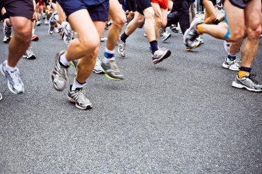 running marathon on city street clipart
