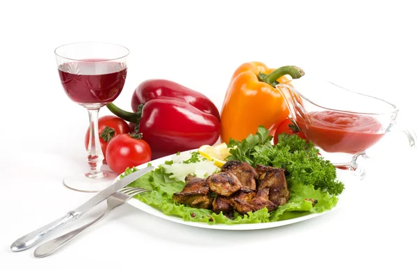 Appetizing weal kebab on skewers with tomatoes, pepper and greens — Stock Photo, Image
