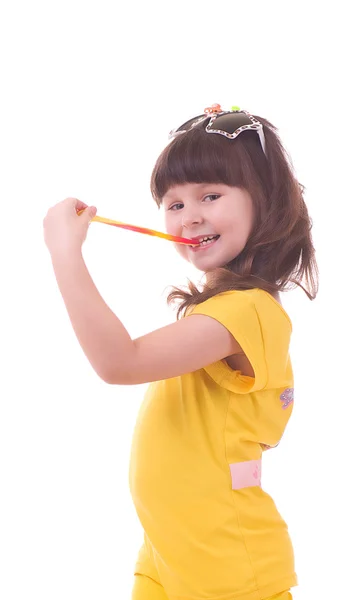 Beautiful little girl with a colorful lollipop — Stock Photo, Image