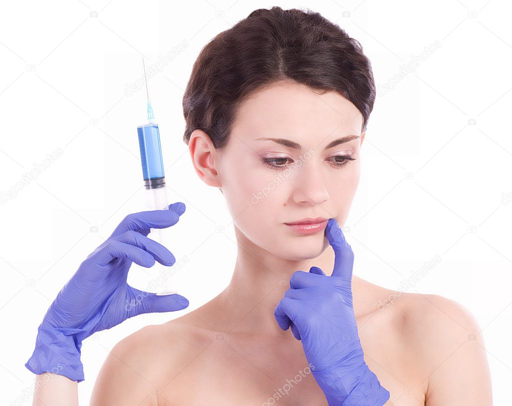 Beautiful woman gets an injection in her face
